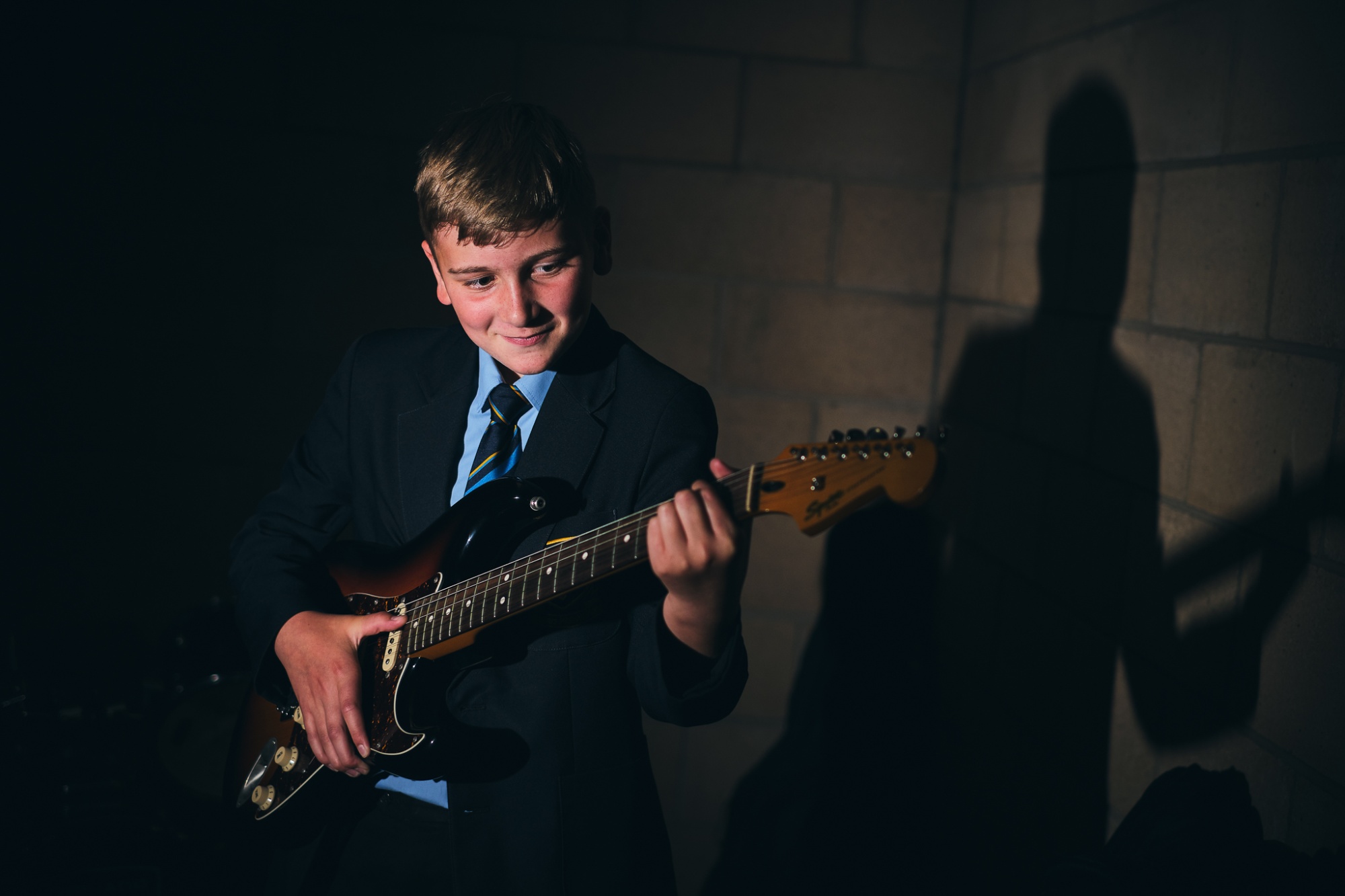 student playing guitar