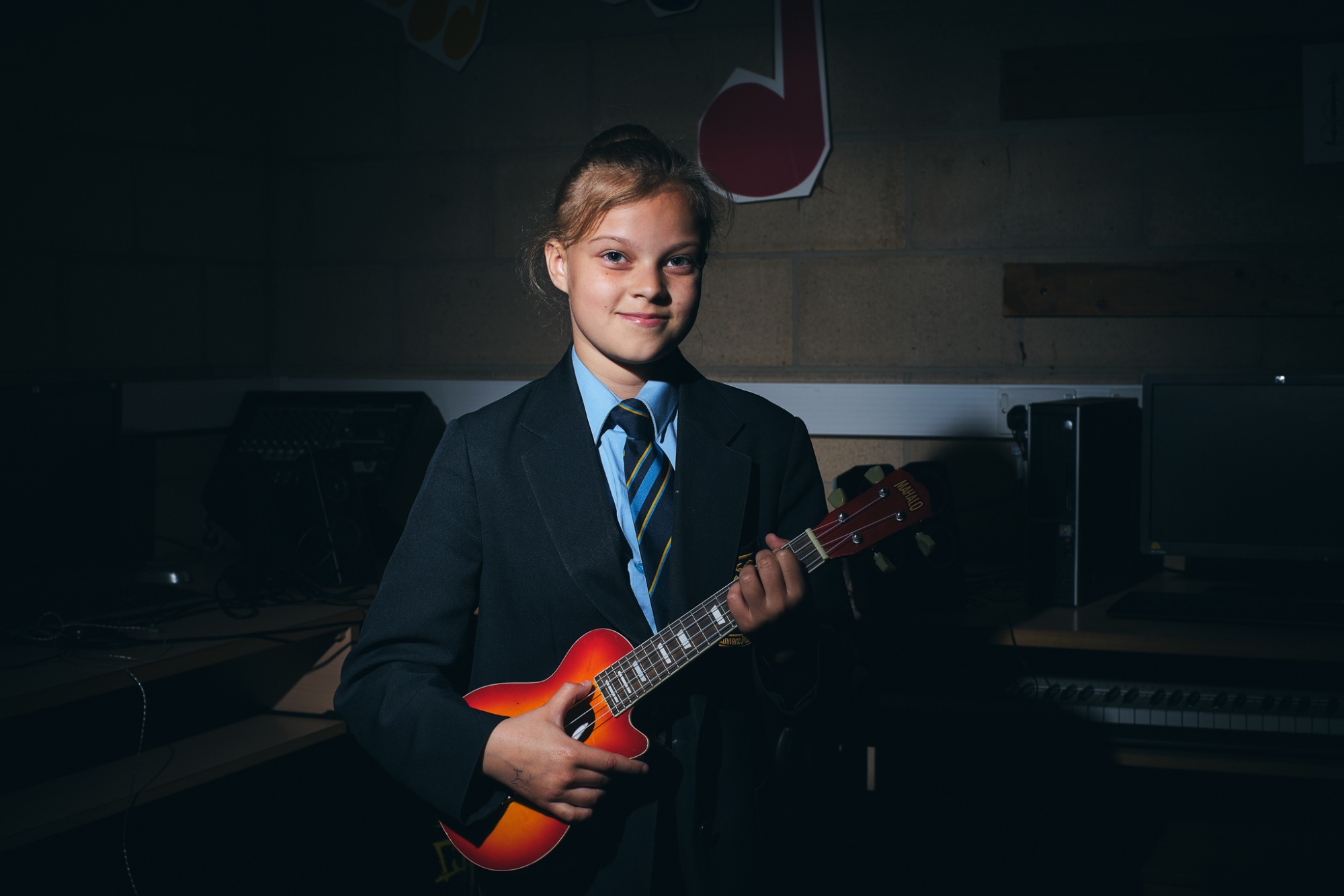 student playing ukulele